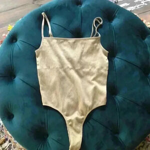 Forever 21 tan bodysuit size small. In great condition!